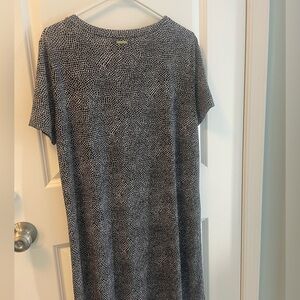 Black and white geometric dress. Cute brass detail and cut out short sleeve